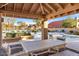 Community pool area with tables, chairs, and lounge chairs surrounding the refreshing pool at 9280 E Davenport Dr, Scottsdale, AZ 85260