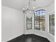 Bright dining room with modern chandelier and black tile floor at 9631 E Palm Ridge Dr, Scottsdale, AZ 85260