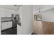 Modern kitchen featuring stainless steel appliances, sleek cabinets, and hardwood floors at 9631 E Palm Ridge Dr, Scottsdale, AZ 85260