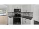 Kitchen with stainless steel stove, oven, microwave, mosaic backsplash, granite countertop at 9631 E Palm Ridge Dr, Scottsdale, AZ 85260