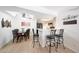 Bright dining area featuring a ceiling fan, decor, and view of the kitchen and bar seating at , Mesa, AZ 85201