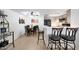 Open concept dining area with wood-look floors, decor, and a view of the kitchen at , Mesa, AZ 85201