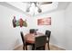 Cozy dining area with a round table and four chairs under a ceiling fan at , Mesa, AZ 85201