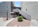 Charming condo exterior with a private patio, walkway, and desert landscaping at , Mesa, AZ 85201