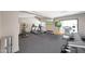 Community gym area featuring updated equipment, fitness balls, and tv at , Mesa, AZ 85201