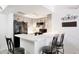 Charming kitchen with light gray cabinetry, white counters, and black appliances at , Mesa, AZ 85201