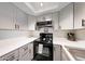 Efficient kitchen featuring updated cabinets, stainless steel sink, and modern appliances at , Mesa, AZ 85201