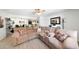 Open-concept living area with a large sectional sofa, modern lighting, and neutral decor at , Mesa, AZ 85201