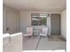 Front patio space with seating and a secure gate entrance with unit number 151 at , Mesa, AZ 85201