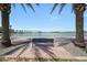 Beautiful view of the pond lined with palm trees and a bench to sit and relax at , Mesa, AZ 85201