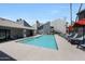 Community pool area, with lounge chairs, umbrellas and palm trees at , Mesa, AZ 85201