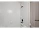 Clean bathroom with tiled walls, a bathtub, and black fixtures at 101 N 7Th St # 168, Phoenix, AZ 85034