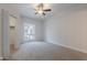 Carpeted bedroom featuring a ceiling fan, neutral walls, and a closet at 101 N 7Th St # 168, Phoenix, AZ 85034
