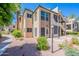 Multi-story building with manicured landscaping and stairwells to upper units at 101 N 7Th St # 168, Phoenix, AZ 85034