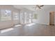 Spacious living room with light wood floors, several windows, and ample natural light at 101 N 7Th St # 168, Phoenix, AZ 85034