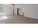 Bright living room with wood-look floors, neutral walls, and a ceiling fan at 101 N 7Th St # 168, Phoenix, AZ 85034
