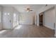 Bright and open living room featuring wood floors, a ceiling fan, and natural light at 101 N 7Th St # 168, Phoenix, AZ 85034