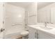 Bathroom featuring a shower-tub combo, vanity with sink, and white color scheme at 10212 E Caballero St, Mesa, AZ 85207