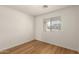 Bedroom with wood-look floors and a neutral color scheme at 10212 E Caballero St, Mesa, AZ 85207
