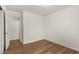 Empty bedroom featuring wood-look floors and a closet, ready for personalization at 10212 E Caballero St, Mesa, AZ 85207