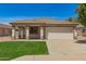 Charming single-story home featuring a desert landscape, a two-car garage, and a cozy front porch at 10212 E Caballero St, Mesa, AZ 85207
