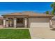 Charming single-story home featuring a desert landscape, a two-car garage, and a cozy front porch at 10212 E Caballero St, Mesa, AZ 85207