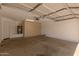 Spacious garage with built-in cabinets, water heater, and plenty of room for parking and storage at 10212 E Caballero St, Mesa, AZ 85207