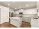 Kitchen featuring white cabinets, stainless appliances, and a center island at 10212 E Caballero St, Mesa, AZ 85207