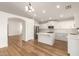 Open-concept kitchen with a central island, stainless steel appliances, and ample cabinetry at 10212 E Caballero St, Mesa, AZ 85207
