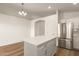 Kitchen with a white island and stainless steel appliances at 10212 E Caballero St, Mesa, AZ 85207