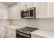 Close up of a modern stainless steel oven and white subway tile backsplash at 10212 E Caballero St, Mesa, AZ 85207