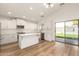Modern kitchen featuring an island, stainless appliances, and bright backyard views at 10212 E Caballero St, Mesa, AZ 85207