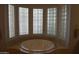 Bright bathroom with a luxurious soaking tub surrounded by bay windows at 11290 N 117Th St, Scottsdale, AZ 85259