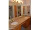 Elegant bathroom vanity features double sinks, granite countertops, and wood cabinets at 11290 N 117Th St, Scottsdale, AZ 85259