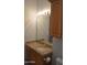 Bathroom featuring a granite countertop, cabinet storage, and a large mirror with updated lighting at 11290 N 117Th St, Scottsdale, AZ 85259