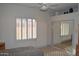 Bright bedroom includes window with shutters and mirrored closet doors at 11290 N 117Th St, Scottsdale, AZ 85259