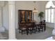 Formal dining room featuring elegant furnishings, chandelier, and built-in display cabinet at 11290 N 117Th St, Scottsdale, AZ 85259
