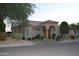 Stunning single-story home with an arched entry, well-manicured landscaping, and a tile roof at 11290 N 117Th St, Scottsdale, AZ 85259
