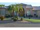 Charming single-story home with an arched entryway, a tiled roof, and mature palm trees enhancing curb appeal at 11290 N 117Th St, Scottsdale, AZ 85259