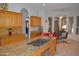 Spacious kitchen with an island cooktop, granite countertops, and breakfast nook with backyard views at 11290 N 117Th St, Scottsdale, AZ 85259