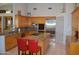 Well-lit kitchen boasts granite countertops, stainless steel appliances, and a large center island at 11290 N 117Th St, Scottsdale, AZ 85259