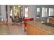 Bright kitchen features a granite island with seating and a breakfast nook overlooking the outdoor pool area at 11290 N 117Th St, Scottsdale, AZ 85259