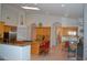 Open-concept kitchen with granite countertops, a large island, and a seamless transition to dining area at 11290 N 117Th St, Scottsdale, AZ 85259