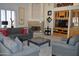 Comfortable living room boasts a fireplace, neutral decor, and built-in shelving for storage and display at 11290 N 117Th St, Scottsdale, AZ 85259