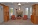 Cozy living room with fireplace, bay window, and custom built-in cabinetry at 11290 N 117Th St, Scottsdale, AZ 85259