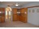 Spacious main bedroom featuring a ceiling fan and custom built-in cabinetry at 11290 N 117Th St, Scottsdale, AZ 85259