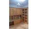 Home office with custom wood cabinets, bookshelves, and a desk for an organized workspace at 11290 N 117Th St, Scottsdale, AZ 85259