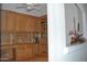 Home office featuring custom wood cabinetry, bookshelves, and a built-in desk area at 11290 N 117Th St, Scottsdale, AZ 85259