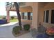Covered outdoor patio with built in grill, table and chairs and mature palm tree at 11290 N 117Th St, Scottsdale, AZ 85259