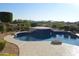 Backyard pool and jacuzzi with tiled platform and a view of distant mountains at 11290 N 117Th St, Scottsdale, AZ 85259
